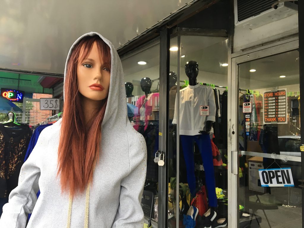 Mannequin in front of the Impulse store is dressed in a new outfit every day
